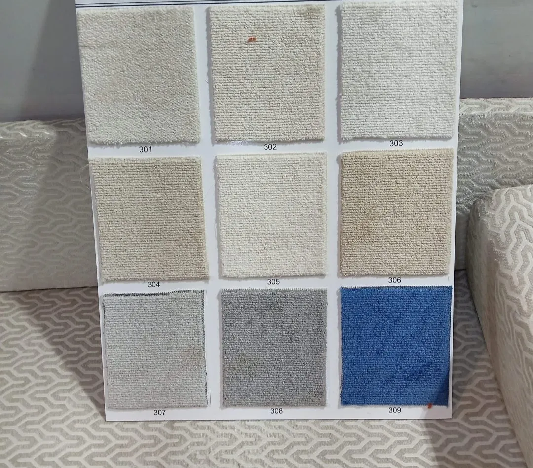 Dana loop-pile carpet swatch board in nine colours: cream white, sand beige, golden beige, light grey, mid grey and royal blue