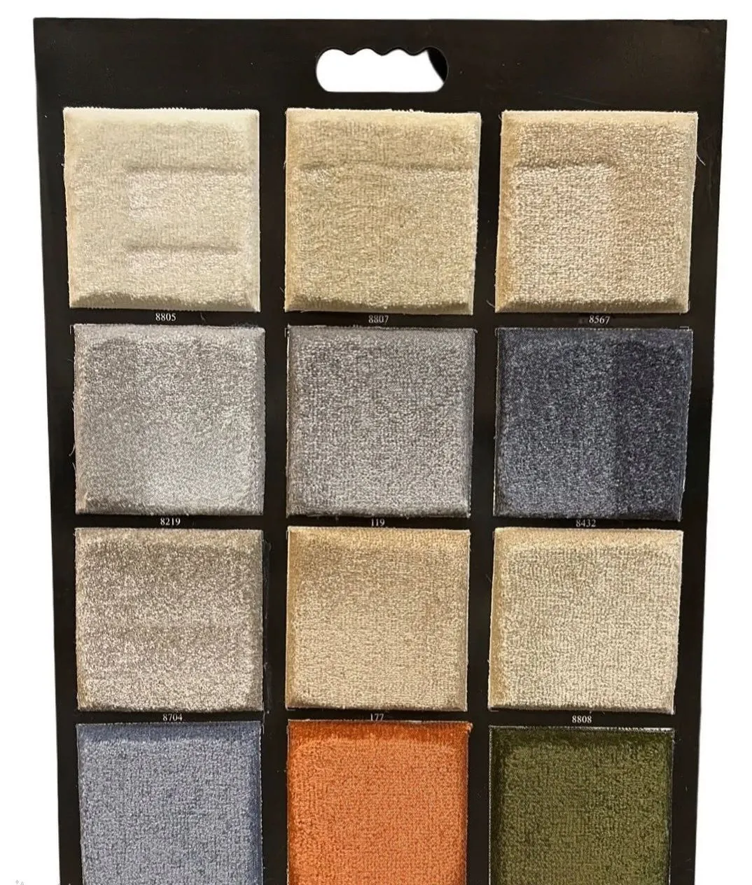 Naseem carpet swatch board in ivory, beige, grey, navy, blue, orange and olive